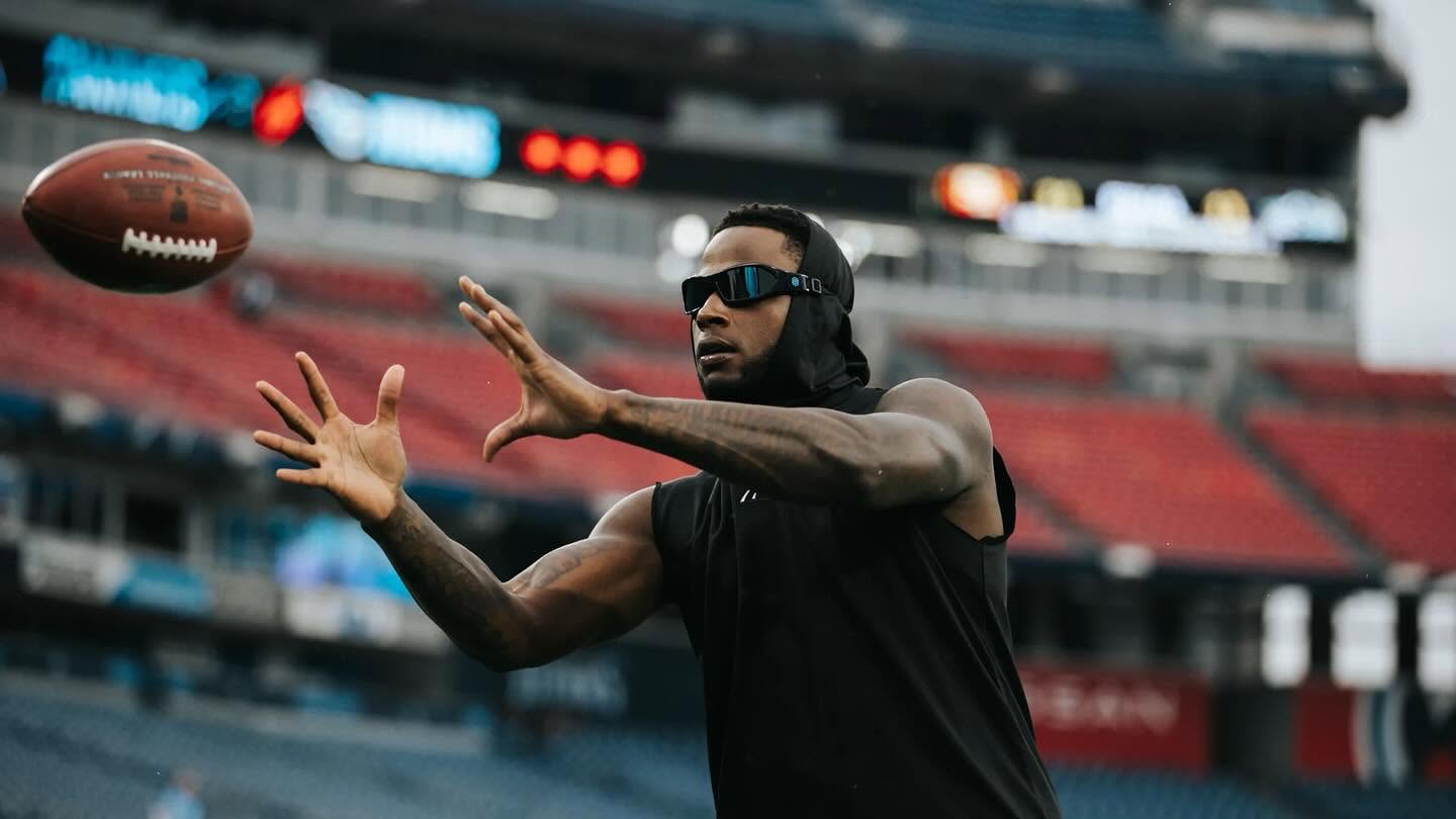 Football athlete tracking an incoming football during sports vision training