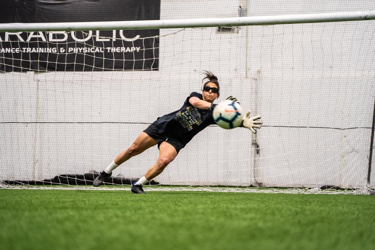 Goalkeeper reacting to a soccer ball
